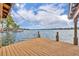 Expansive lakefront dock with wooden decking and seating area at 279 Rippling Ln, Winter Park, FL 32789