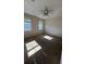 Bright bedroom with carpeted floors and two windows at 6413 Astor Village Ave # 303, Orlando, FL 32835