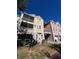 Tan three-story building with balconies and screened porches at 6413 Astor Village Ave # 303, Orlando, FL 32835