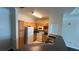Clean condo kitchen with light wood cabinets and white appliances at 6413 Astor Village Ave # 303, Orlando, FL 32835