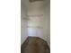 Condo walk-in closet with wire shelving at 6413 Astor Village Ave # 303, Orlando, FL 32835