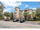 Three-story building with ample parking and lush landscaping at 1301 Tuscan Ter # 9303, Davenport, FL 33896