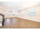 Spacious dining room with wood-look tile flooring and multiple windows at 12737 Brodlove Ln, Winter Garden, FL 34787