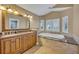 Spa-like bathroom featuring a soaking tub and double vanity at 279 Rippling Ln, Winter Park, FL 32789