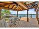 Covered dock with seating area and lake view at 279 Rippling Ln, Winter Park, FL 32789