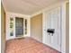 Brick entryway with double doors and sidelight windows at 279 Rippling Ln, Winter Park, FL 32789
