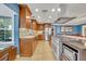 Modern kitchen with stainless steel appliances and a large island at 279 Rippling Ln, Winter Park, FL 32789