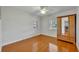 Simple bedroom with hardwood floors and large window at 279 Rippling Ln, Winter Park, FL 32789