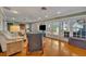 Living room with hardwood floors, sliding glass doors and relaxing view at 279 Rippling Ln, Winter Park, FL 32789
