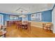 Bright dining room with hardwood floors and a large wooden table at 279 Rippling Ln, Winter Park, FL 32789