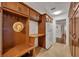 Laundry room with built-in bench and storage at 279 Rippling Ln, Winter Park, FL 32789