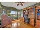 Home office with hardwood floors, built-in shelving, and a view at 279 Rippling Ln, Winter Park, FL 32789