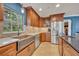 Modern kitchen with a farmhouse sink and stainless steel appliances at 279 Rippling Ln, Winter Park, FL 32789