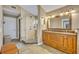 Elegant bathroom with double vanity, large shower, and granite countertop at 279 Rippling Ln, Winter Park, FL 32789