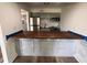 Modern kitchen featuring wood countertops and stainless steel appliances at 1000 Lake Of The Woods Blvd # C205, Fern Park, FL 32730