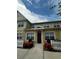 Front view of charming townhome with white picket fence at 4000 Santa Maria Dr # 105, Kissimmee, FL 34741