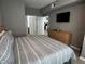 King-size bed with views into another room and bathroom at 4000 Santa Maria Dr # 105, Kissimmee, FL 34741