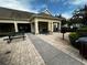 Community patio with tables, chairs, and grill at 4000 Santa Maria Dr # 105, Kissimmee, FL 34741