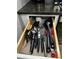 Kitchen drawer with organized cooking utensils at 4000 Santa Maria Dr # 105, Kissimmee, FL 34741