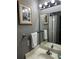 Bathroom with sink and mirror, gray walls at 4000 Santa Maria Dr # 105, Kissimmee, FL 34741