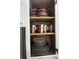White kitchen cabinet with colorful dishware at 4000 Santa Maria Dr # 105, Kissimmee, FL 34741