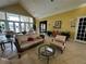 Relaxing community room with comfortable seating and large windows at 4000 Santa Maria Dr # 105, Kissimmee, FL 34741