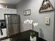 Kitchen with stainless steel refrigerator and white cabinets at 4000 Santa Maria Dr # 105, Kissimmee, FL 34741