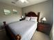 Bright bedroom with a comfortable bed and wooden furniture at 4000 Santa Maria Dr # 105, Kissimmee, FL 34741