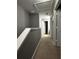 Upper hallway with carpeted floors and access to bedrooms at 4000 Santa Maria Dr # 105, Kissimmee, FL 34741