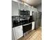 Modern kitchen with stainless steel appliances and white cabinets at 4000 Santa Maria Dr # 105, Kissimmee, FL 34741