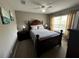 Bedroom with a double bed and dark wood furniture at 4000 Santa Maria Dr # 105, Kissimmee, FL 34741
