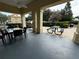 Community patio with seating and picnic tables at 4000 Santa Maria Dr # 105, Kissimmee, FL 34741