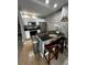 Kitchen with breakfast bar, stainless steel appliances, and granite countertops at 4000 Santa Maria Dr # 105, Kissimmee, FL 34741