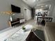 Open living room with modern decor and kitchen view at 4000 Santa Maria Dr # 105, Kissimmee, FL 34741