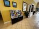 Community lobby with brochures and a seating area at 4000 Santa Maria Dr # 105, Kissimmee, FL 34741