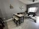 Small dining area with modern table and chairs at 4000 Santa Maria Dr # 105, Kissimmee, FL 34741