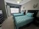 Two twin beds with teal bedding in a well-lit room at 4000 Santa Maria Dr # 105, Kissimmee, FL 34741