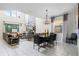 Open concept dining and living room with tile floors at 5431 Solterra Cir, Davenport, FL 33837