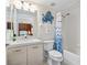Clean bathroom with a light wood vanity, shower, and tub at 4631 S Atlantic Ave # 8301, Ponce Inlet, FL 32127
