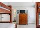 Bedroom with built-in bunk beds and dresser at 4631 S Atlantic Ave # 8301, Ponce Inlet, FL 32127