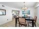 Bright dining room with a dark wood table and ocean view at 4631 S Atlantic Ave # 8301, Ponce Inlet, FL 32127