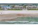 Aerial view of beachfront building and shoreline at 4631 S Atlantic Ave # 8301, Ponce Inlet, FL 32127