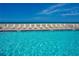 Inviting pool area with ocean views and lounge chairs at 4631 S Atlantic Ave # 8301, Ponce Inlet, FL 32127