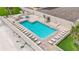 Aerial view of refreshing pool area with plenty of lounge chairs at 4631 S Atlantic Ave # 8301, Ponce Inlet, FL 32127