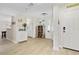Open entryway with tile floors, beach decor, and kitchen view at 4631 S Atlantic Ave # 8301, Ponce Inlet, FL 32127