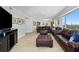 Living area featuring brown leather furniture and ocean view at 4631 S Atlantic Ave # 8301, Ponce Inlet, FL 32127