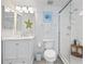 Bathroom with white vanity, walk-in shower, and starfish decor at 4631 S Atlantic Ave # 8301, Ponce Inlet, FL 32127
