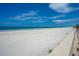 Beautiful beach view with a wall and lounge chairs at 4631 S Atlantic Ave # 8301, Ponce Inlet, FL 32127