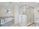 Bathroom with large walk-in shower and soaking tub at 4631 S Atlantic Ave # 8301, Ponce Inlet, FL 32127