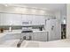 Modern kitchen with white cabinets and stainless steel appliances at 4631 S Atlantic Ave # 8301, Ponce Inlet, FL 32127